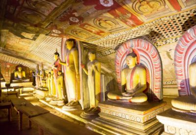 Ancient golden statues in buddha temple on Ceylon. Sri Lanka, Unesco heritage. Asia culture, bubbhism religion